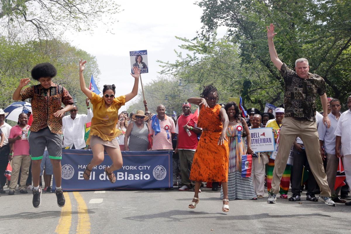 NYC Mayor Bill deBlasio and his family dance at the 2014 West Indian American Day Carnival.