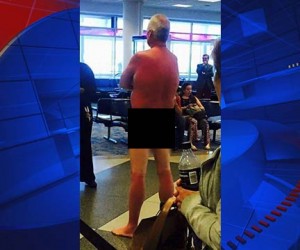 Overbooked Jamaica Flight Stirs Passenger To Strip Naked man-strips-down