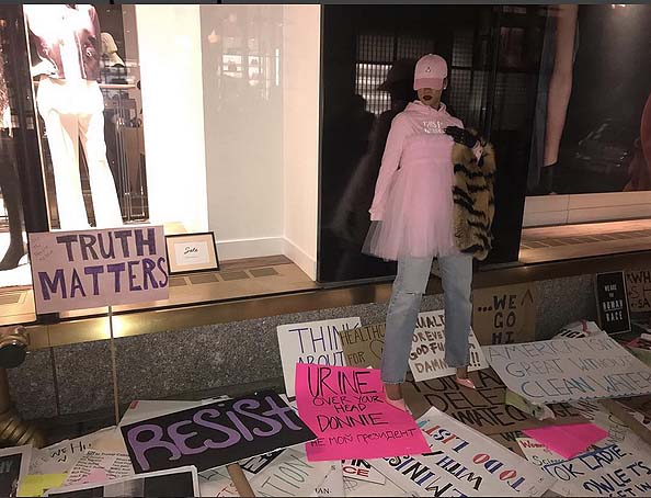  Rihanna stands over strewn signs at the Women's March in NYC. (Instagram image)