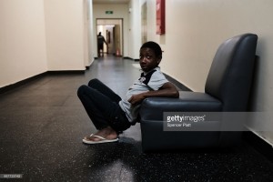  A displaced  Barbudian child sits inside a shelter at a cricket stadium on December 7, 2017 in St John's, Antigua. 