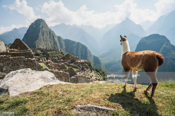 Inca citadel in the Andes Mountains and the river valley below. latin-america-travel