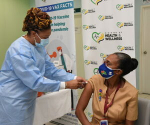 Jamaica Opens National Arena For Vaccination As COVID-19 Cases Soar first-person-in-jamaica-to-get-vaccine