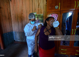 woman-gets-vaccine-in-brazil