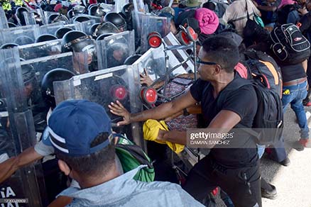 migrants-clash-with-mexico-national-guard