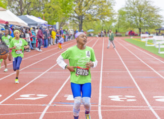 Guyanese, Latin American Roots Athletes Win At Colgate Women’s Games Colgate Women’s Games runner, Caribbean roots Kushanna Medas-King, completing her race at Queens College. (Photo by Elliot Mangual/Colgate-Palmolive)
