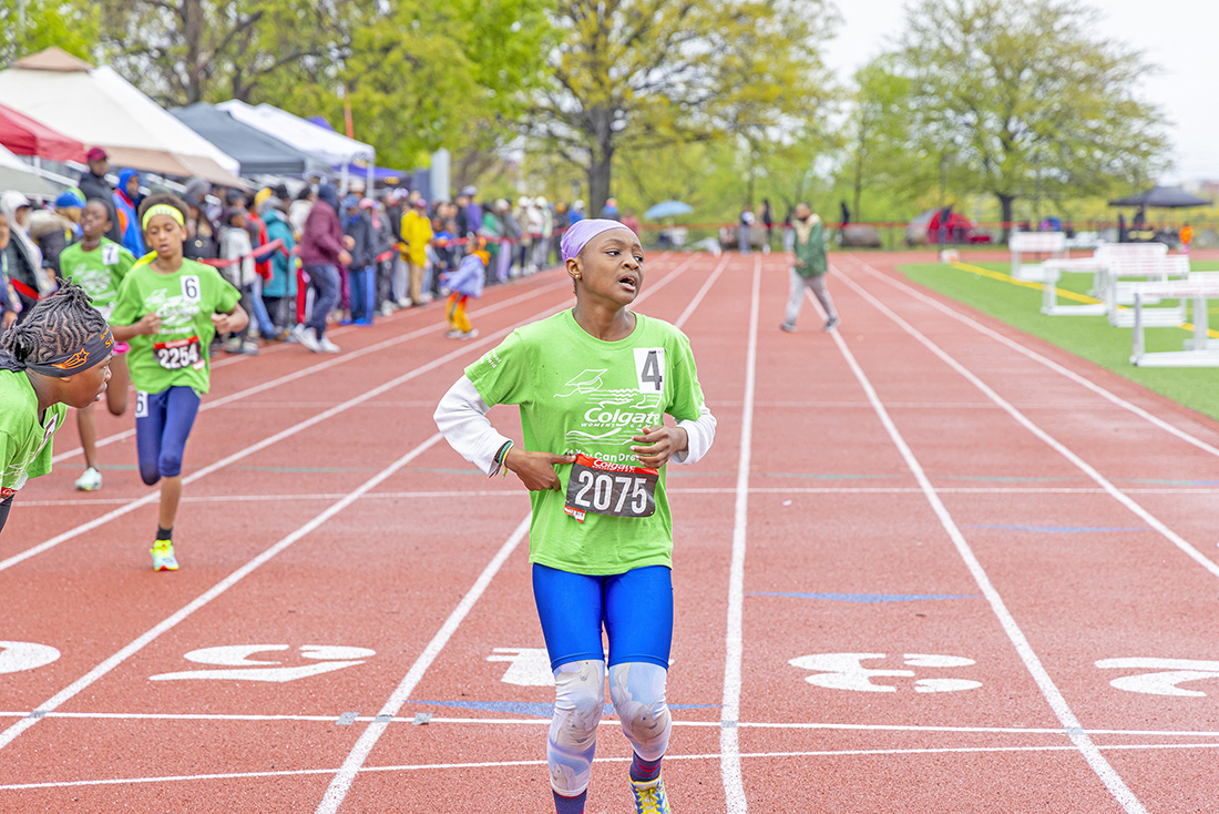 Colgate Women’s Games runner, Caribbean roots Kushanna Medas-King, completing her race at Queens College. (Photo by Elliot Mangual/Colgate-Palmolive)