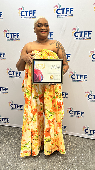 Territory Director Jael Joseph poses with her award for Best Short Documentary