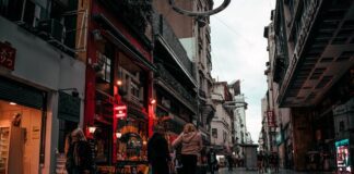 people walking between buildings on a street in Buenos Aires, Argentina