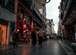 people walking between buildings on a street in Buenos Aires, Argentina