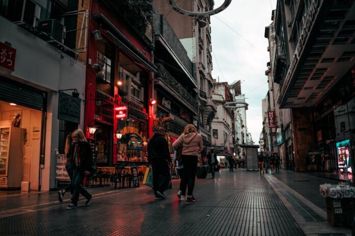 24-hours-in-buenos-aires people walking between buildings on a street in Buenos Aires, Argentina