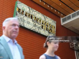 us-national-debt-clock-ticks-on