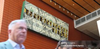 us-national-debt-clock-ticks-on