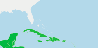 Map of the Caribbean showing 2025 economic freedom levels, with Barbados and Jamaica in green for freer economies, and Cuba and Haiti in red as repressed economies.