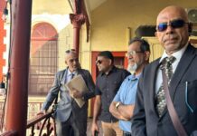 Extradition Hearing For US-Indicted Guyanese MP And Next Opposition Leader -Azruddin Mohamed – Set to Resume Next Year Azruddin Mohamed stands with his lawyers outside the Georgetown Magistrates’ Court during his ongoing US extradition proceedings.