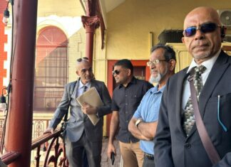 Extradition Hearing For US-Indicted Guyanese MP And Next Opposition Leader -Azruddin Mohamed – Set to Resume Next Year Azruddin Mohamed stands with his lawyers outside the Georgetown Magistrates’ Court during his ongoing US extradition proceedings.