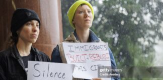 Demonstrators protest ICE detentions during the New Orleans City Council delay amid Trump’s nationwide immigration sweep, Louisiana, December 2025.