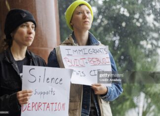 Demonstrators protest ICE detentions during the New Orleans City Council delay amid Trump’s nationwide immigration sweep, Louisiana, December 2025.