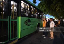 Caribbean Competition – Weak Competition Is Holding Back Growth In The Caribbean And Latin America – IDB Passengers wait to board an overcrowded bus during a nationwide blackout in the Dominican Republic, causing major transportation disruptions.
