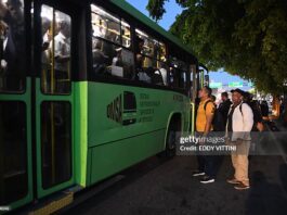 Caribbean Competition – Weak Competition Is Holding Back Growth In The Caribbean And Latin America – IDB Passengers wait to board an overcrowded bus during a nationwide blackout in the Dominican Republic, causing major transportation disruptions.