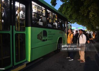 Caribbean Competition – Weak Competition Is Holding Back Growth In The Caribbean And Latin America – IDB Passengers wait to board an overcrowded bus during a nationwide blackout in the Dominican Republic, causing major transportation disruptions.