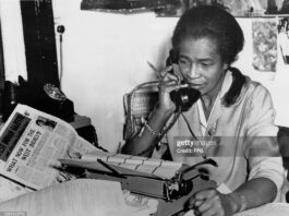 Unsung Caribbean Heroes You Didn’t Learn About in School Claudia Jones, Trinidad-born journalist and activist, working at her desk while advocating for Black rights and Caribbean communities in the diaspora.