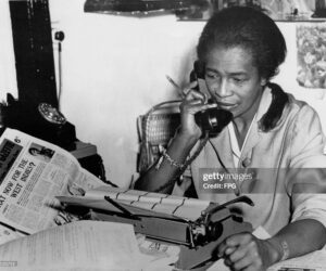 Unsung Caribbean Heroes You Didn’t Learn About in School Claudia Jones, Trinidad-born journalist and activist, working at her desk while advocating for Black rights and Caribbean communities in the diaspora.