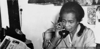 Claudia Jones, Trinidad-born journalist and activist, working at her desk while advocating for Black rights and Caribbean communities in the diaspora.
