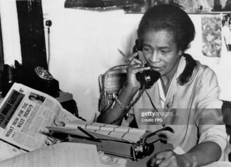 Unsung Caribbean Heroes You Didn’t Learn About in School Claudia Jones, Trinidad-born journalist and activist, working at her desk while advocating for Black rights and Caribbean communities in the diaspora.