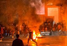 Iranians gather while blocking a street during a protest in Tehran, Iran on January 9, 2026. The nationwide protests started in Tehran's Grand Bazaar against the failing economic policies in late December, which spread to universities and other cities, and included economic slogans, to political and anti-government ones. (Photo by MAHSA / Middle East Images / AFP via Getty Images)
