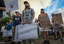 Demonstrators protest against Immigration and Customs Enforcement (ICE) and demanding the closure of the immigrant detention center known as "Alligator Alcatraz" outside the center at the Dade-Collier Training and Transition Airport in Ochopee, Florida, on January 11, 2026. A US Immigration and Customs Enforcement (ICE) agent shot and killed 37-year-old Renee Nicole Good on the streets of Minneapolis on January 7, leading to huge protests and outrage from local leaders who rejected White House claims she was a domestic terrorist.