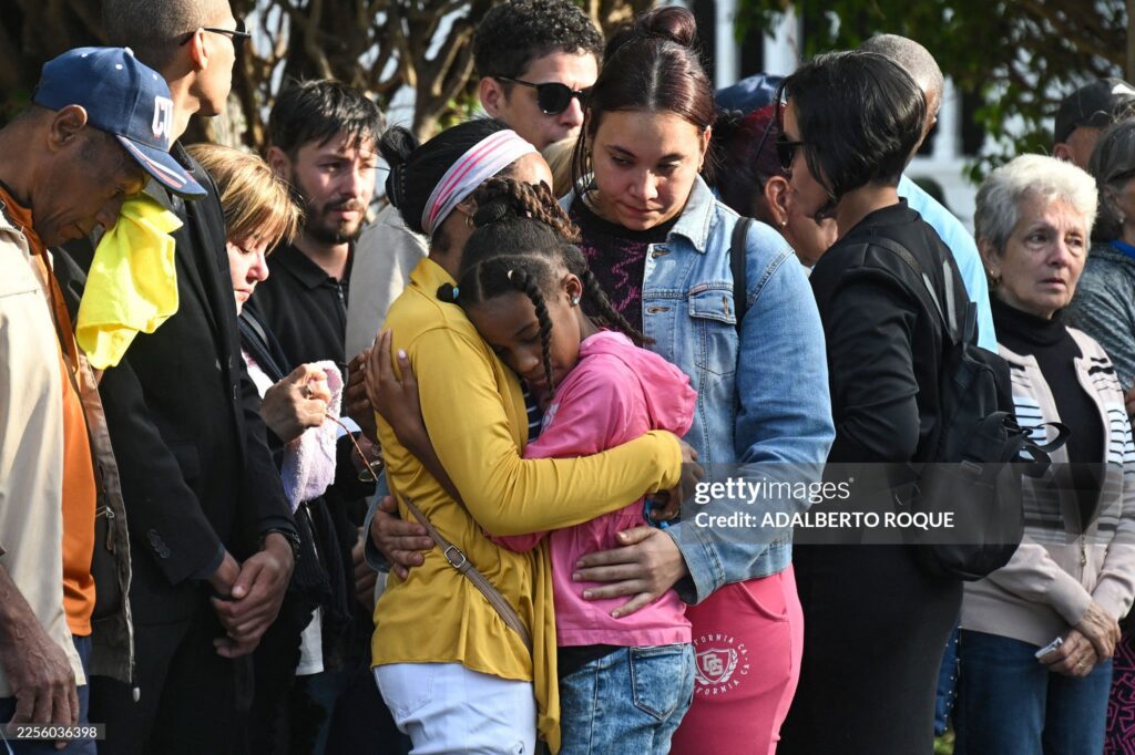 Relatives of the 32 Cuban soldiers killed during the US incursion in Venezuela attend their funeral at Colon cemetery in Havana on January 16, 2026. 
