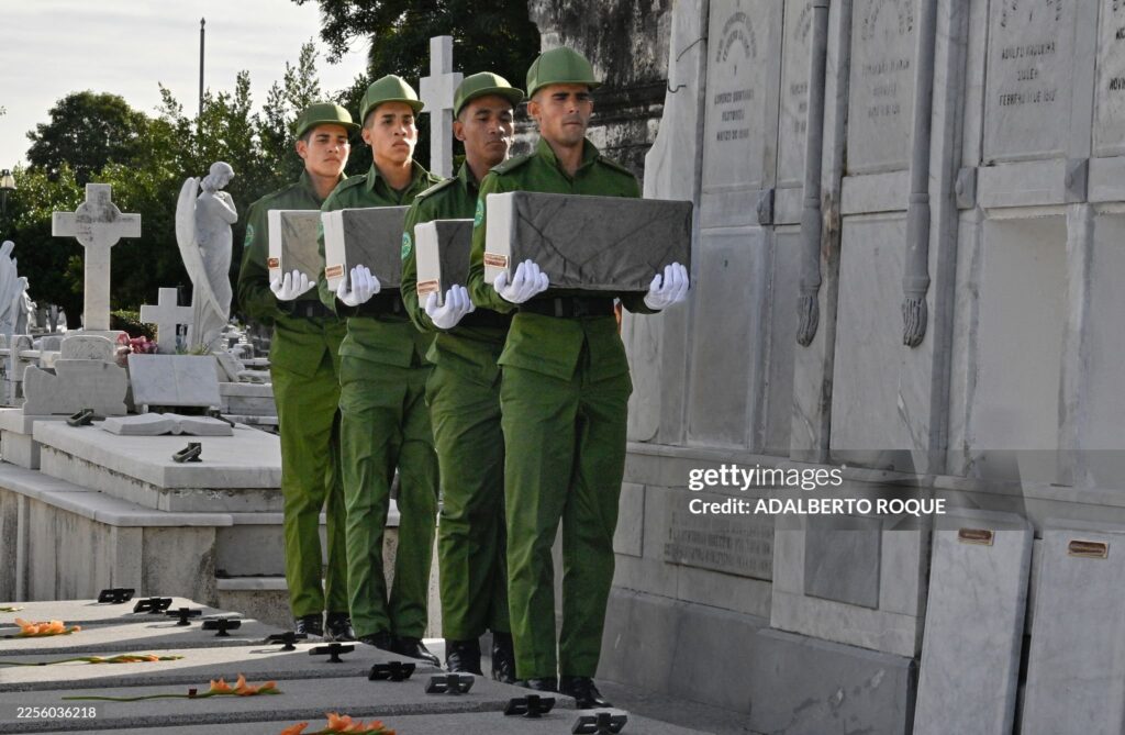 Cuban soldiers carry the remains of some of the 32 Cuban soldiers killed during the US incursion in Venezuela during their funeral at Colon cemetery in Havana on January 16, 2026. The capture by US forces of Venezuelan leader Nicolas Maduro on January 3, 2026, and the killing in the operation of 32 Cubans assigned to protect him represent a major blow for the island's revered intelligence services, experts say. 