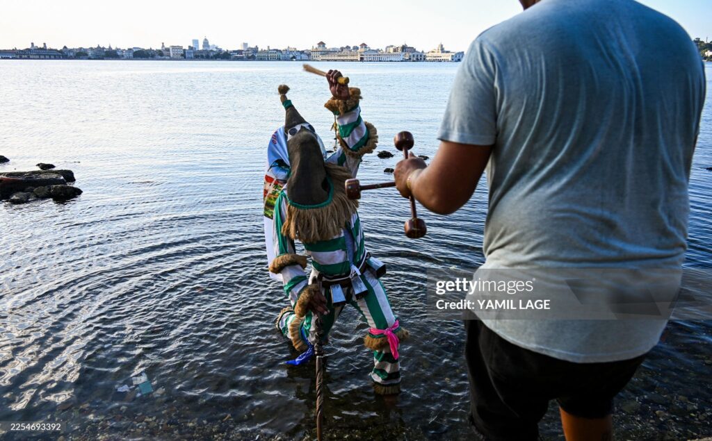 An Ireme, the masked dancer of the male religious secret society known as Abakua (or Nanigo), performs during Abakua Day celebrations in the Regla neighborhood of Havana, Cuba on January 8, 2026. 