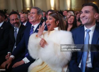 Musician Nicki Minaj laughs during remarks by U.S. President Donald Trump