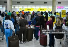 Caribbean Airspace Closure Trigger Mass Flight Cancellations As Regional Tensions Rise passengers-at-puerto-rico-airport-amid-cancellations-jan-3-2026