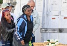 Relatives of some of the 32 Cuban soldiers killed during the US incursion in Venezuela pay respects at their graves during their funeral at Colon cemetery in Havana on January 16, 2026. The capture by US forces of Venezuelan leader Nicolas Maduro on January 3, 2026, and the killing in the operation of 32 Cubans assigned to protect him represent a major blow for the island's revered intelligence services, experts say.