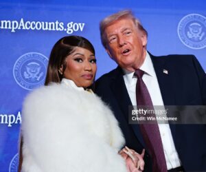 Musician Nicki Minaj (L) joins U.S. President Donald Trump on stage as he delivers remarks during the Treasury Department's Trump Accounts Summit at Andrew W. Mellon Auditorium on January 28, 2026 in Washington, DC. "Trump Accounts" are a portion of recently passed tax and spending legislation where the federal government will deposit $1,000 into investment accounts for every child born between 2025 and 2028 once parents sign their children up while filing their income taxes.  (Photo by Win McNamee/Getty Images)