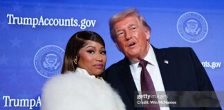 Trinidad-Born Rapper Nicki Minaj Signals Citizenship Move Musician Nicki Minaj (L) joins U.S. President Donald Trump on stage as he delivers remarks during the Treasury Department's Trump Accounts Summit at Andrew W. Mellon Auditorium on January 28, 2026 in Washington, DC. "Trump Accounts" are a portion of recently passed tax and spending legislation where the federal government will deposit $1,000 into investment accounts for every child born between 2025 and 2028 once parents sign their children up while filing their income taxes. (Photo by Win McNamee/Getty Images)