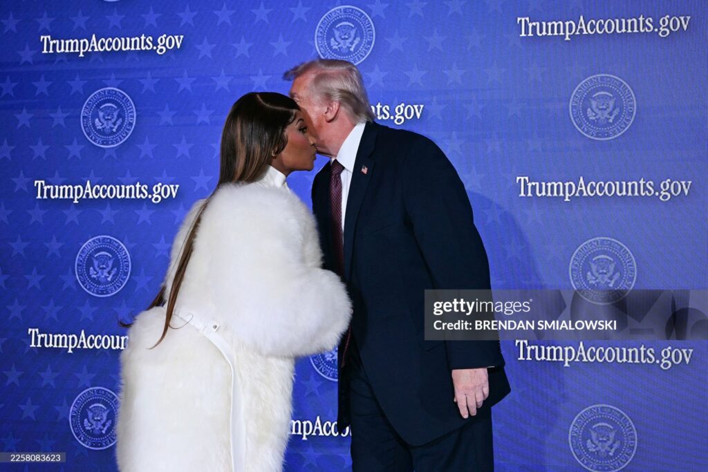 US President Donald Trump (R) greets Trinidadian rapper and singer-songwriter Nicki Minaj during an event on 'Trump Accounts' at the Andrew W. Mellon Auditorium in Washington, DC, on January 28, 2026. as she says she is his number one fan.
