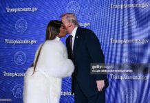 US President Donald Trump (R) greets Trinidadian rapper and singer-songwriter Nicki Minaj during an event on 'Trump Accounts' at the Andrew W. Mellon Auditorium in Washington, DC, on January 28, 2026. as she says she is his number one fan.