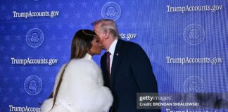 US President Donald Trump (R) greets Trinidadian rapper and singer-songwriter Nicki Minaj during an event on 'Trump Accounts' at the Andrew W. Mellon Auditorium in Washington, DC, on January 28, 2026. as she says she is his number one fan.