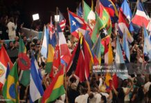 Performers wave the flags of sovereign countries in the Caribbean and the Americas at the conclusion of Puerto Rican singer Bad Bunny performance during Super Bowl LX Patriots vs Seahawks Apple Music Halftime Show at Levi's Stadium in Santa Clara, California on February 8, 2026