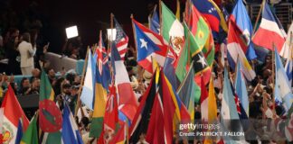 Performers wave the flags of sovereign countries in the Caribbean and the Americas at the conclusion of Puerto Rican singer Bad Bunny performance during Super Bowl LX Patriots vs Seahawks Apple Music Halftime Show at Levi's Stadium in Santa Clara, California on February 8, 2026