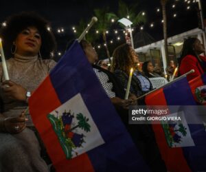 People attend a candlelight vigil for Haitians living in the US under the Temporary Protected Status (TPS) immigration program in Miami, Florida on February 3, 2026. Late on February 2, federal judge Ana C. Reyes of the Federal District Court in Washington, blocked the Trump administration from ending TPS for an estimated 350,000 Haitian immigrants. The status, which offers protection from deportation and work authorization, was set to expire on Feb. 3. 2026