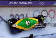 Jamaica's Mica Moore during the Women's Monobob Bobsleigh Heat 1 at the Cortina Sliding Centre, on day nine of the Milano Cortina 2026 Winter Olympics, Italy