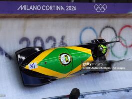 Caribbean Athletes Are Breaking Geography’s Limits On The World’s Coldest Stage – The Winter Olympics Jamaica's Mica Moore during the Women's Monobob Bobsleigh Heat 1 at the Cortina Sliding Centre, on day nine of the Milano Cortina 2026 Winter Olympics, Italy
