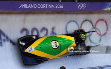 Jamaica's Mica Moore during the Women's Monobob Bobsleigh Heat 1 at the Cortina Sliding Centre, on day nine of the Milano Cortina 2026 Winter Olympics, Italy