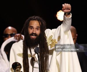 Jamaican musician Keznamdi accepts the Grammy for Best Reggae Album for "BLXXD & FYAH" on stage during the 68th Annual Grammy Awards Premiere Ceremony at the Crypto.com Arena in Los Angeles on February 1, 2026.