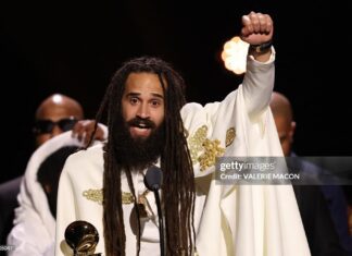 Keznamdi Wins 2026 Reggae Grammy As Caribbean Artists Turn Spotlight on Immigration Jamaican musician Keznamdi accepts the Grammy for Best Reggae Album for "BLXXD & FYAH" on stage during the 68th Annual Grammy Awards Premiere Ceremony at the Crypto.com Arena in Los Angeles on February 1, 2026.