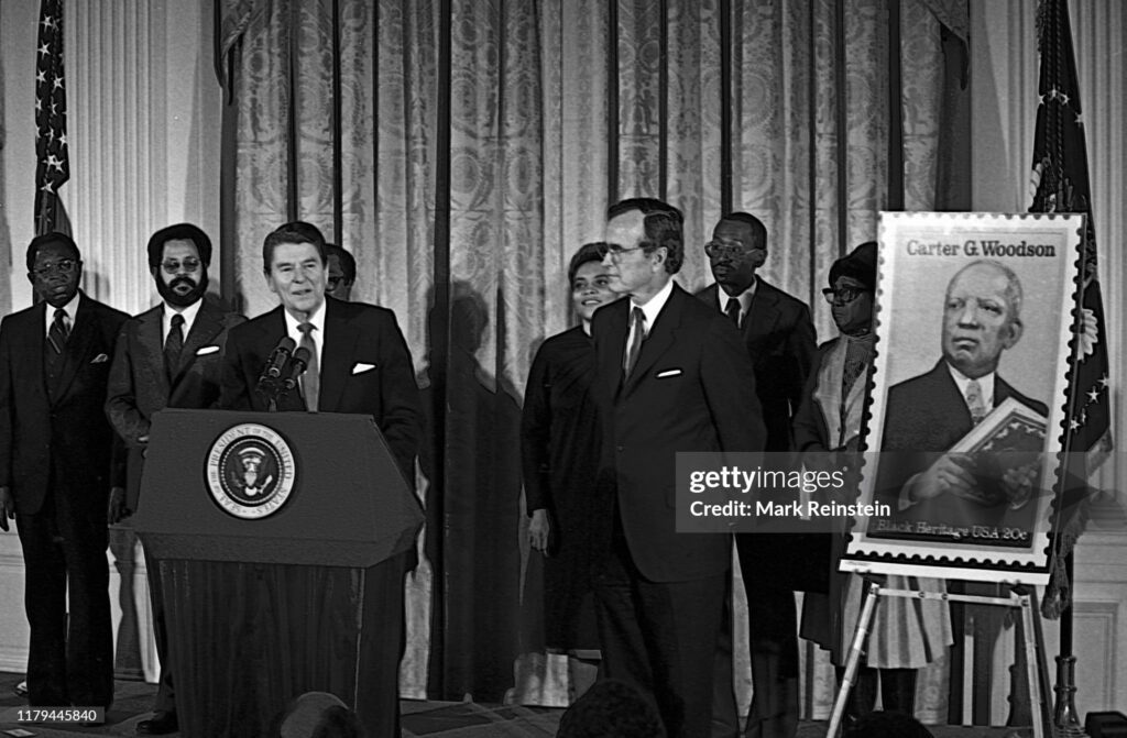 FLASHBACK - Late Republican President Ronald Reagan unveils postage stamp of Carter Woodson (father of black history) at a White House Ceremony marking the observance of National Afro-American (Black) History Month, Washington DC, February 2, 1984.